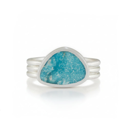 Kingman Turquoise Ring by Ana Eugenia, featuring a bright blue triangular turquoise cabochon with natural matrix in a brushed sterling silver bezel and layered band.