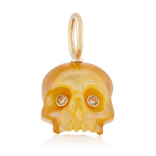 Golden Mother of Pearl Skull Baby charm by Maura Green, hand-carved from natural golden mother of pearl with sparkling diamond eyes and 14k yellow gold details.