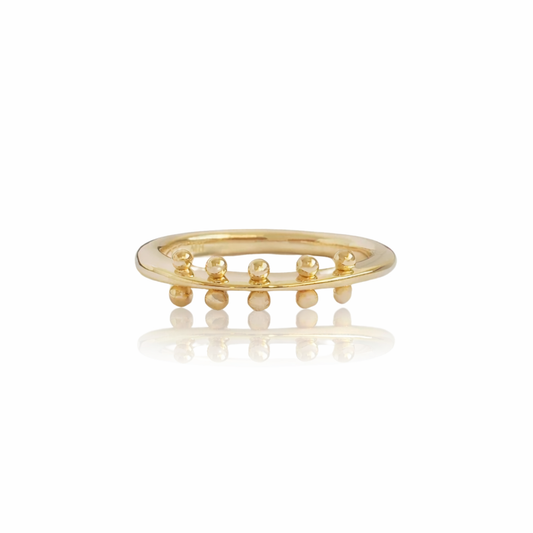 Maya Ring by M. Hisae, handcrafted in solid 14k yellow gold with five delicate granule bead sets along a slender textured band.