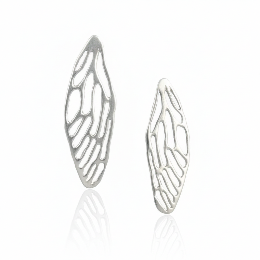 Pair of sterling silver Medium Cicada Wing Earrings featuring intricate openwork insect wing patterns and a sculptural finish.