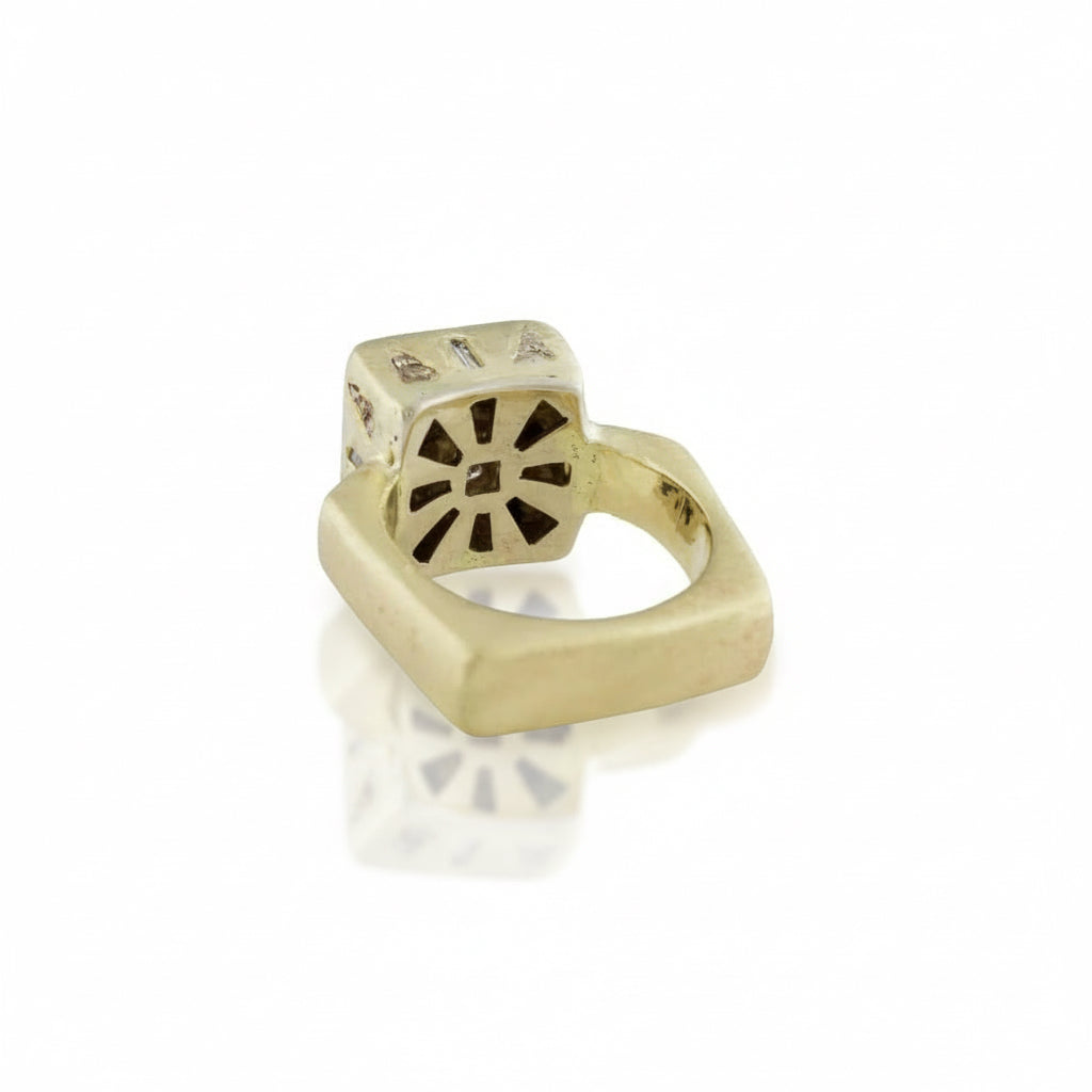 Underside of the handcrafted Mesa Ring revealing an intricate floral-inspired openwork gallery beneath its geometric diamond setting.