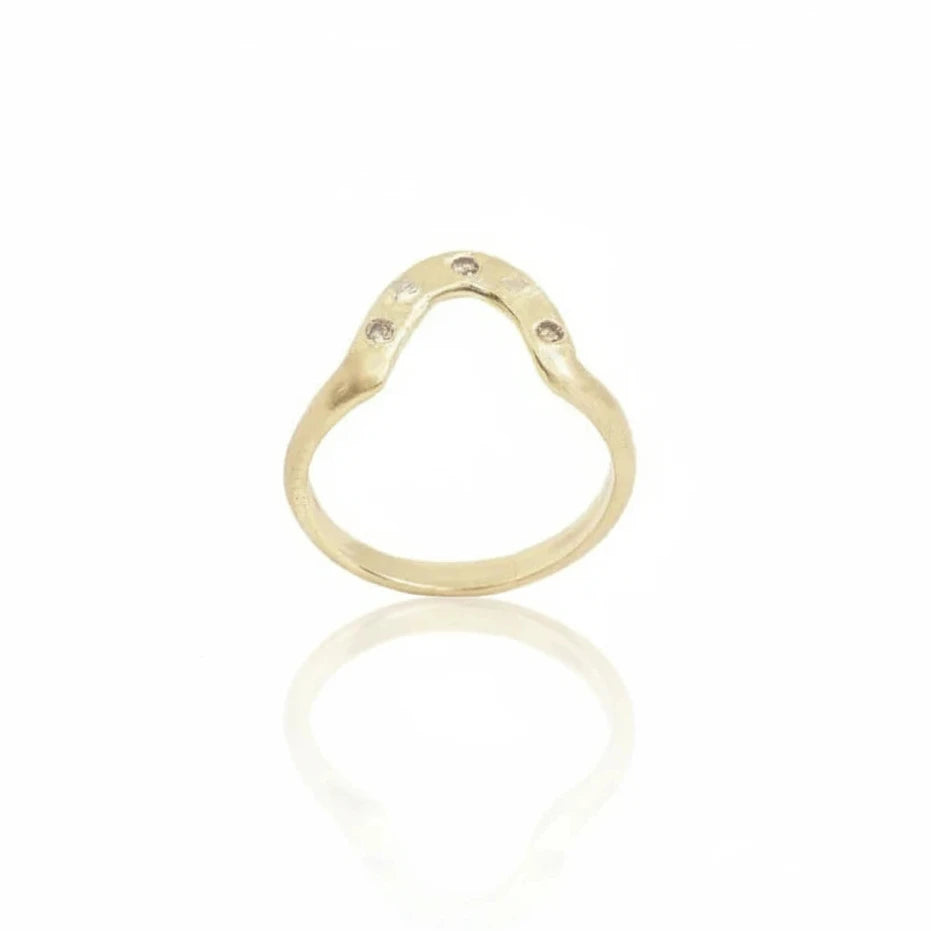 Handcrafted Meta Aura Ring by Alexis Pavlantos in 14k yellow gold with white gold rock accents and three recycled baguette diamonds, featuring a sculptural curved band.