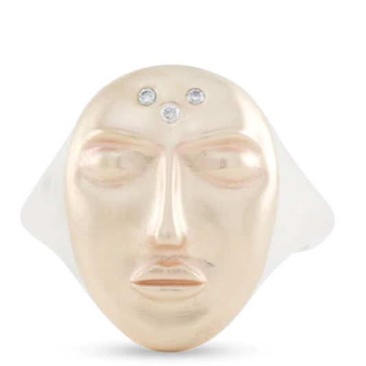 Sculptural face ring by Michaela Farkasovska in sterling silver with 14k yellow gold and three white diamonds.