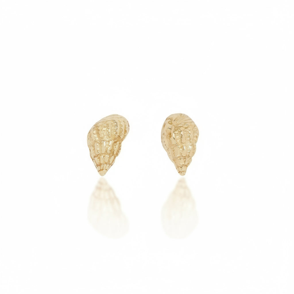 Pair of Micro Wentletrap Seashell Stud Earrings in solid 14k yellow gold, featuring delicate hand-carved spiral shell details by Alexis Pavlantos.