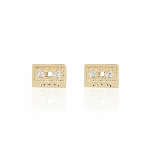 Mini Mixtape Stud Earrings by KIMA in solid 14k yellow gold, featuring miniature cassette tape designs with flush-set white diamonds.