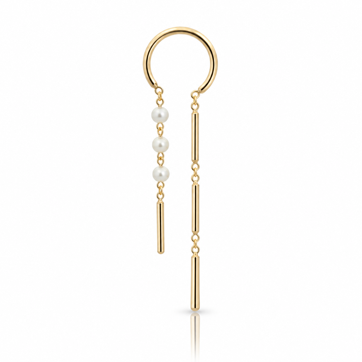 Mismatched 14k yellow gold chime earrings by JACK & G featuring delicate white pearls, slender articulated gold drops, and small hoop closures.