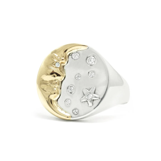 Michaela Farkasovska Moon Whisperer Signet Ring featuring a sculptural 14k yellow gold crescent moon face, sterling silver band, and nine white diamonds.