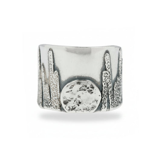 Wide sterling silver Moonrise Cigar Band by Erin Cuff featuring oxidized cactus engraving and a rising moon design.
