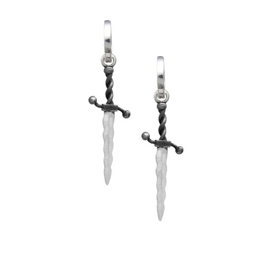 Weaponry Wavy Dagger Huggie Earrings by Morgaine Faye in sterling silver, featuring sculptural medieval dagger charms with oxidized handles and curved blades suspended from polished hoops.