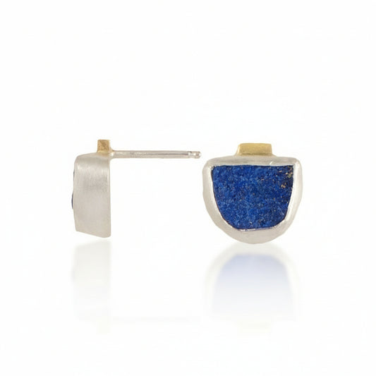 Natural Surface Lapis Lazuli Stud Earrings by Ana Eugenia, featuring textured ultramarine blue half-round lapis stones set in sterling silver with 14k yellow gold accents.