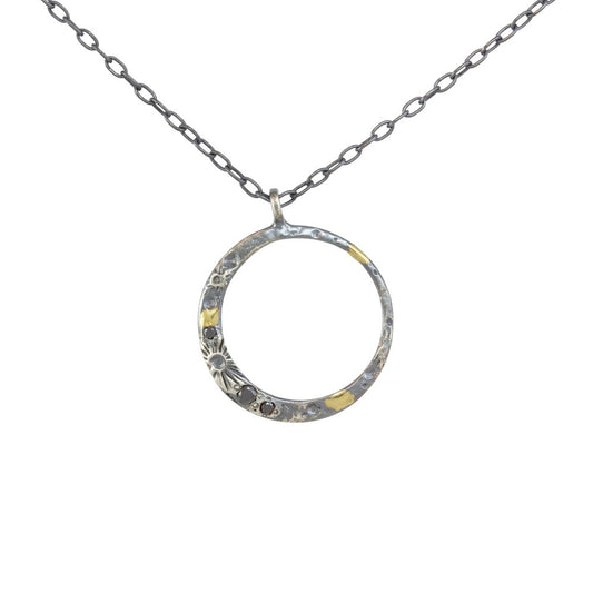 New Moon Necklace by Luana Coonen, featuring an oxidized sterling silver crescent moon pendant with three black diamonds and 18k yellow gold accents.