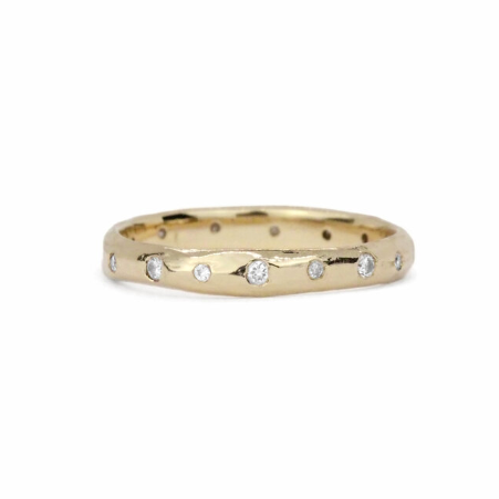 Noemi Scattered Diamond Band by Ladha Jewelry in solid 14k yellow gold, featuring flush-set white diamonds scattered across an organically textured band.