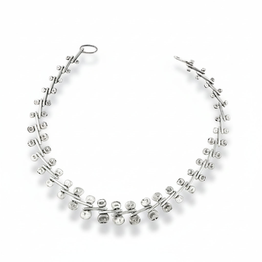 Handcrafted sterling silver Ocotillo Collar Necklace by Erin Cuff featuring an intricate kinetic chain with sculptural moving links.