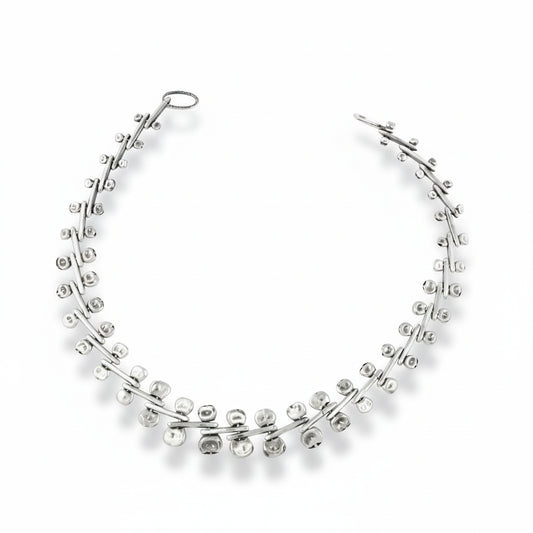 Handcrafted sterling silver Ocotillo Collar Necklace by Erin Cuff featuring an intricate kinetic chain with sculptural moving links.