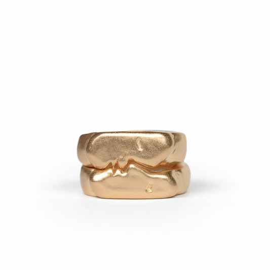 Kiss Signets Gold by Oxbow, featuring two interlocking sculptural rings handcrafted in 14k gold vermeil over sterling silver.