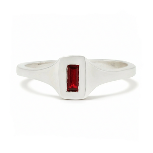 Sterling silver Passage Ring by Adeline Jewelry featuring a deep red baguette-cut garnet in a sleek rectangular setting on a white background.