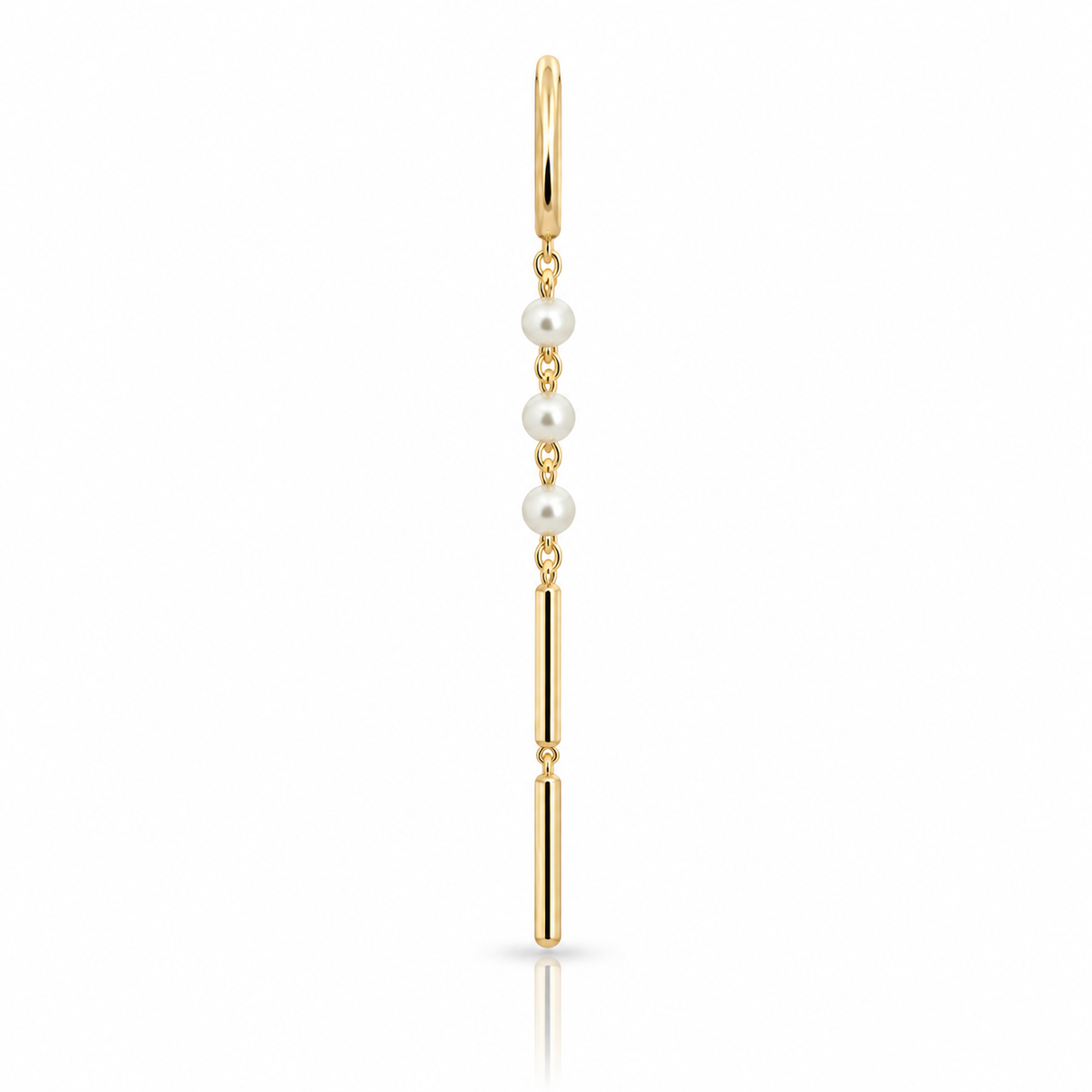 Side view of a delicate 14k yellow gold pearl chime earring showing three white pearls, a long gold drop, and a small hoop closure.