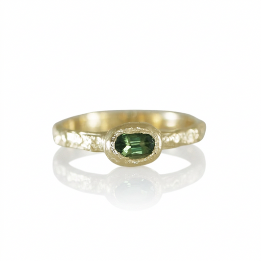 Petite Sapphire Petra Ring in recycled 14k yellow gold featuring a natural 0.38-carat green-yellow sapphire set in a hand-carved, rock-textured band.