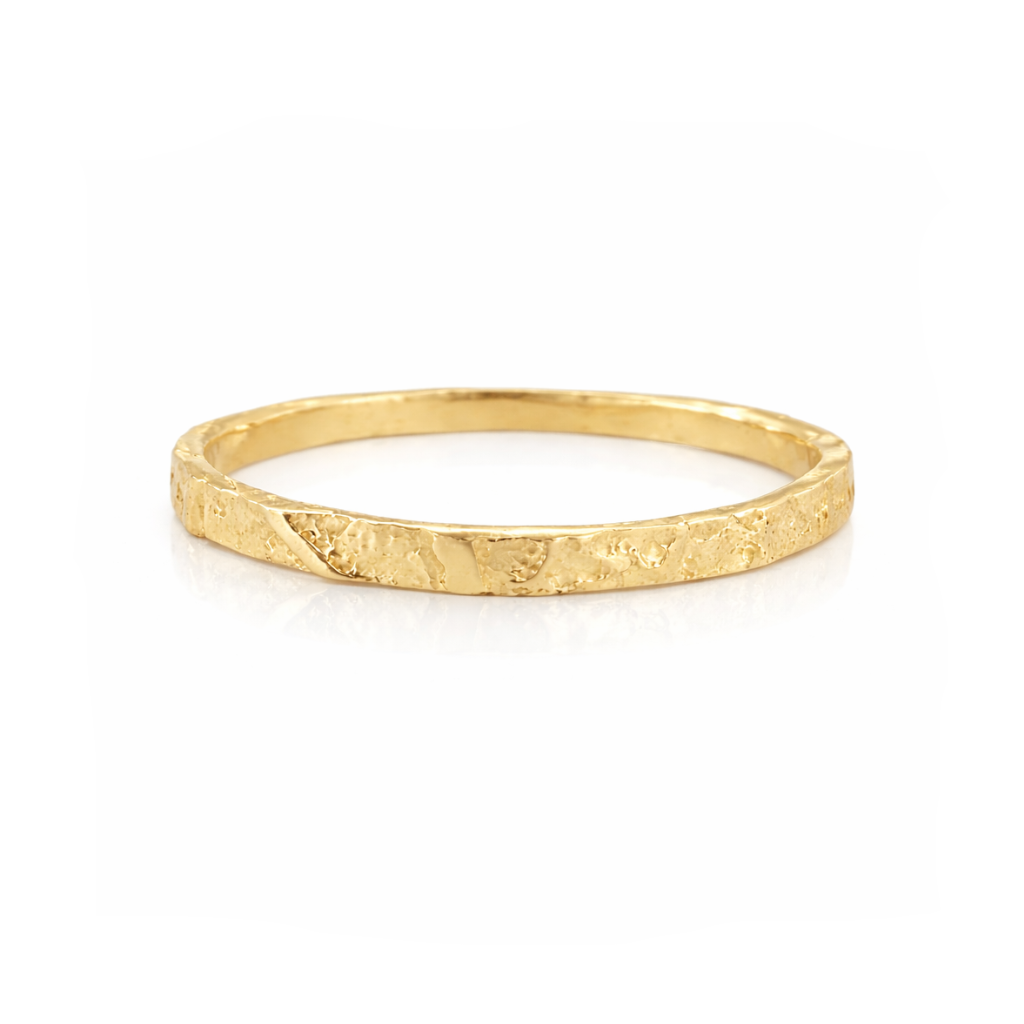 Front view of the Philo Leaf Stacker Ring in solid 14k yellow gold, featuring a delicate hand-carved leaf-inspired texture and slim stacking band.
