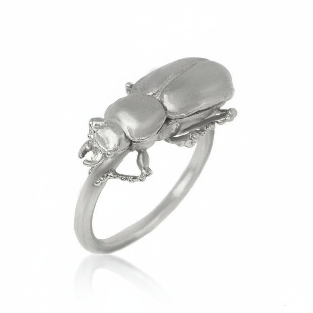 Side view of the Pinacate Beetle Ring in sterling silver, highlighting the detailed beetle sculpture and slender band.