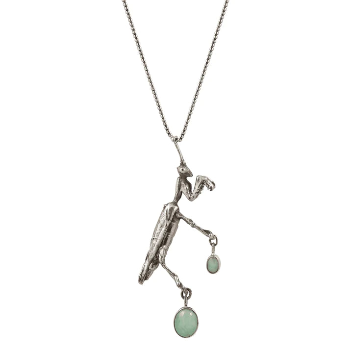 Praying Mantis Necklace in recycled sterling silver featuring a hand-carved insect pendant with oval jade gemstones set in 14k yellow gold bezels.
