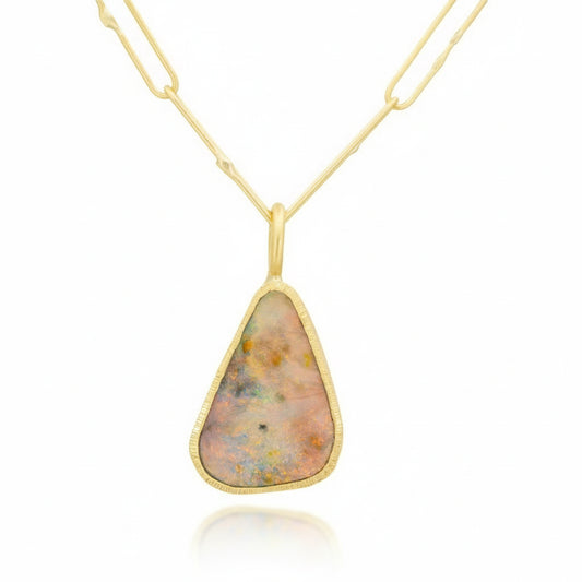 Rainbow Opal pendant in 18k yellow gold with a hand-engraved bezel and smooth matte finish.