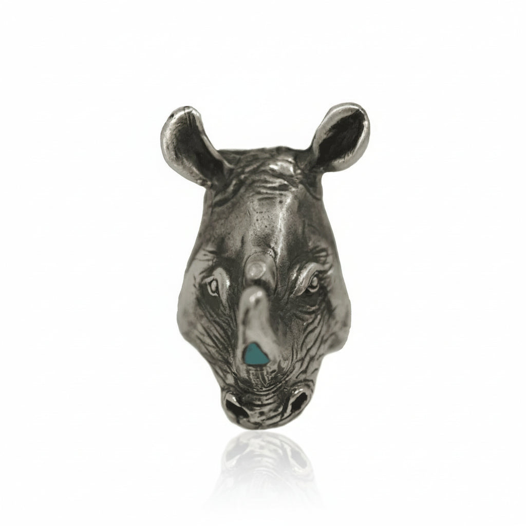 Front view of the one-of-a-kind Rhino Ring in sterling silver, featuring a hand-carved rhinoceros head with turquoise inlay and a rose-cut diamond accent.