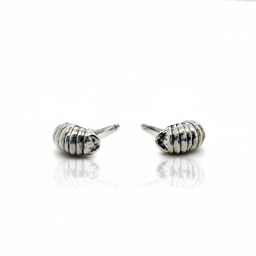 Angled view of the Roly Poly Stud Earrings in sterling silver, showing their sculptural segmented texture and compact rounded shape.
