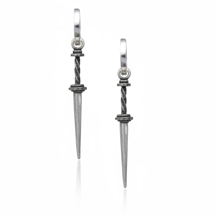 Pair of silver dagger-shaped earrings on a white background