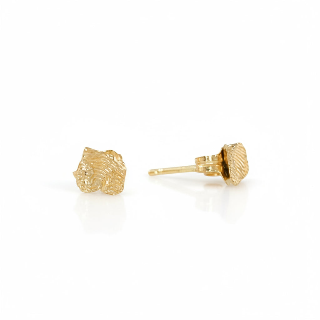 Side view of a 14k gold Sandia Fragmented stud earring showing the hand-sculpted texture and post.