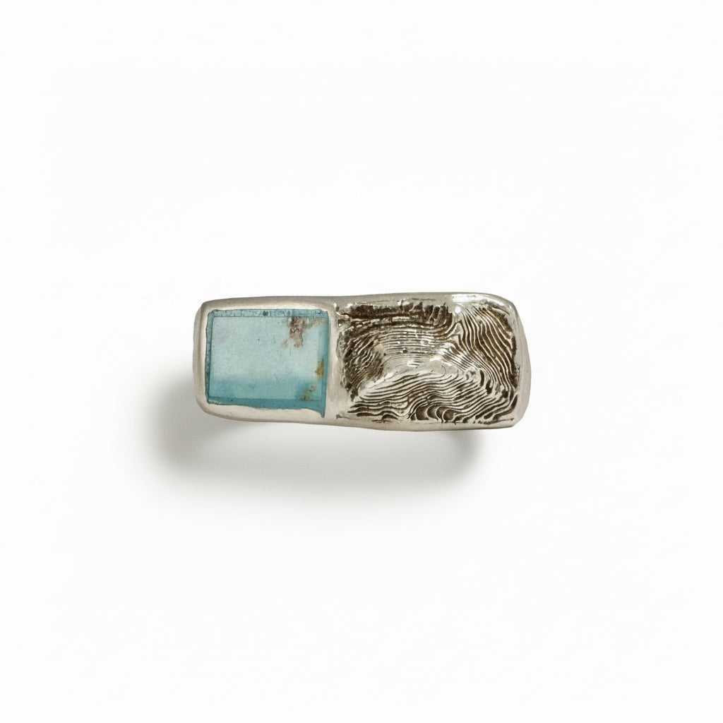 Sterling silver Sandia Sideways signet ring with hand-inlaid turquoise and sculpted mountain landscape design.