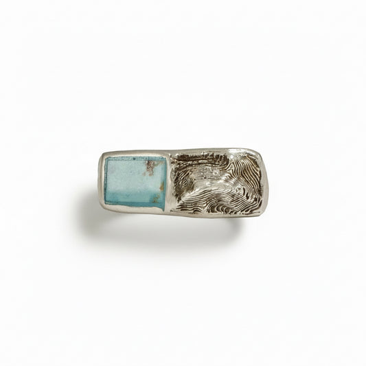 Sterling silver Sandia Sideways signet ring with hand-inlaid turquoise and sculpted mountain landscape design.