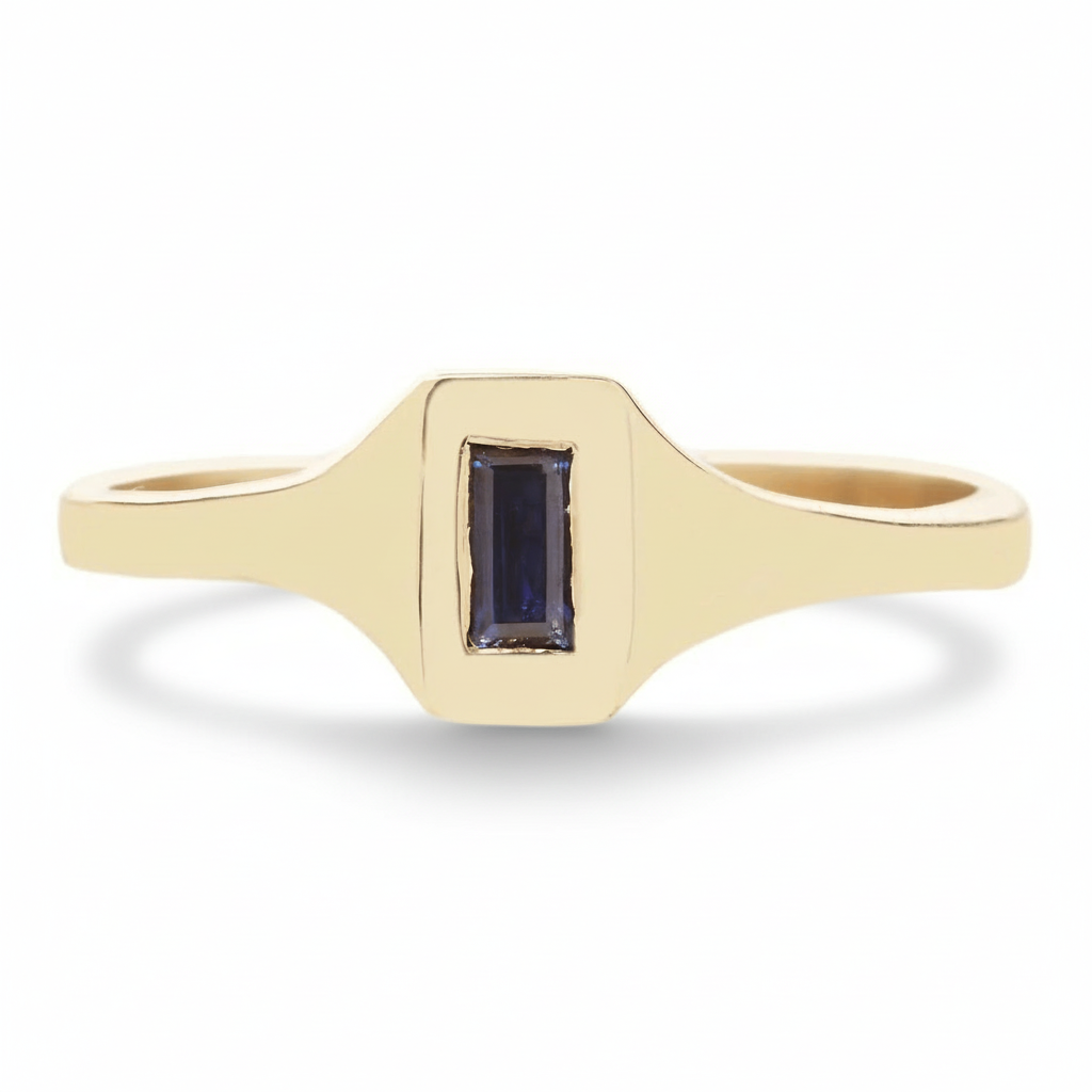14k yellow gold signet-style ring with a blue baguette-cut Australian sapphire on a white background.