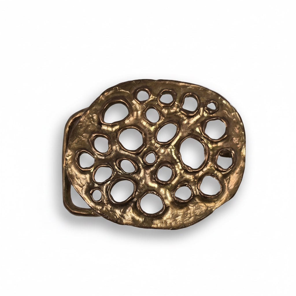 Angled front view of Shaya Durbin's bronze Lotus Belt Buckle showing its sculptural openwork pattern, rounded organic edges and warm bronze finish.