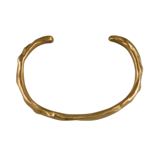 Handcrafted Carved Bronze Cuff Bracelet by Shaya Durbin featuring an organic, irregular sculptural shape and a warm golden bronze finish.