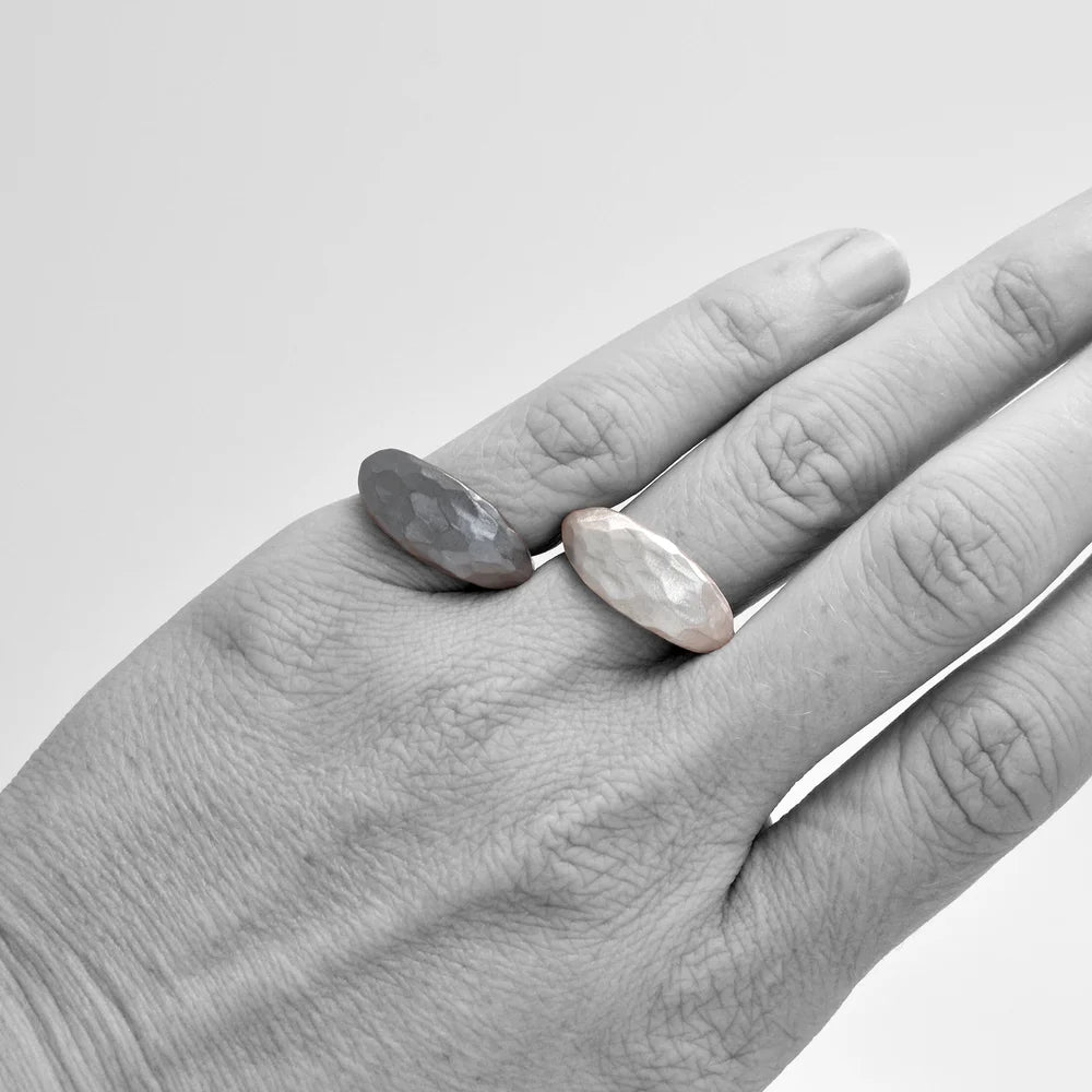 Shaya Durbin's Carved Marquise Signet Ring worn on a hand, showing its elongated silver face, sculptural profile and understated design.