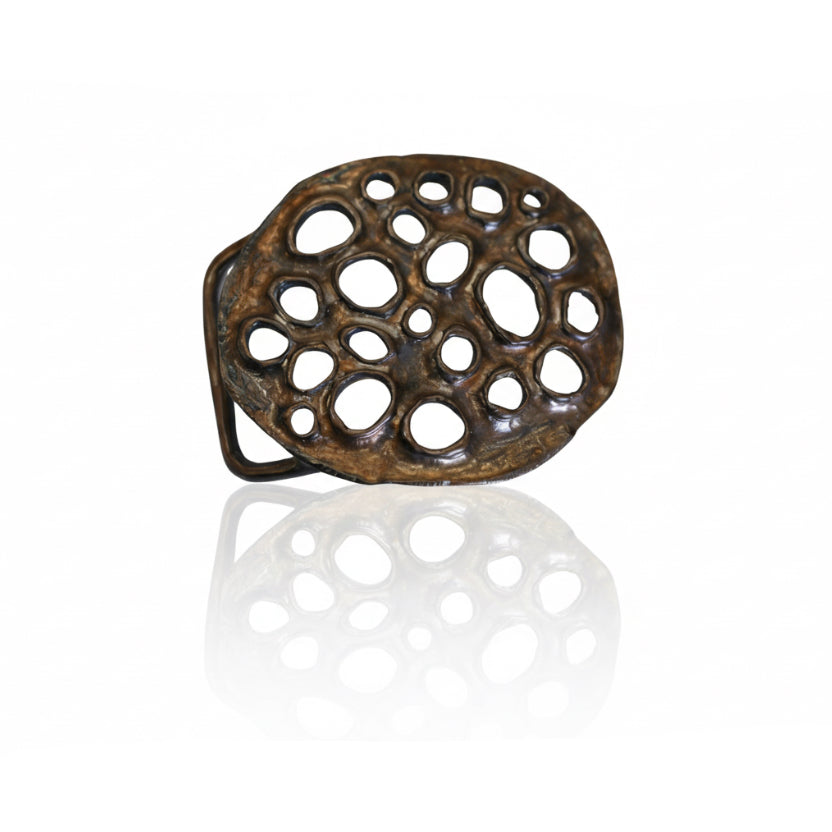 Lotus Belt Buckle by Shaya Durbin handcrafted in bronze, featuring an organic openwork design with irregular circular cutouts inspired by lotus forms.