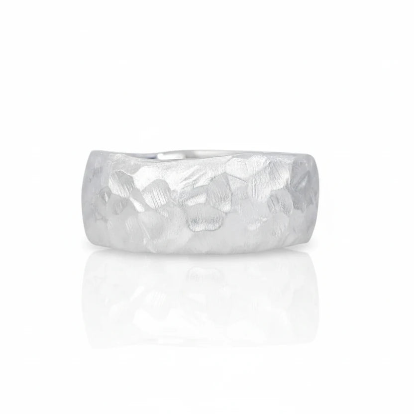 Alternate view of Shaya Durbin's Silver Hammered Band showing its softly faceted sterling silver surface, matte finish and substantial ring profile.