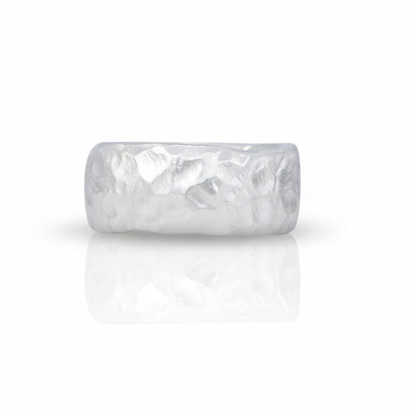 Silver Hammered Band by Shaya Durbin in recycled sterling silver, featuring a wide textured surface, irregular hammered finish and sculptural design.