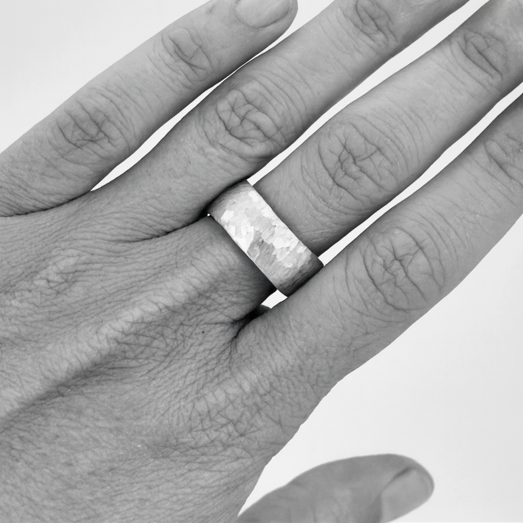 Shaya Durbin Silver Hammered Band worn on a hand, showing the 9.5mm wide recycled sterling silver band and its textured hammered surface.