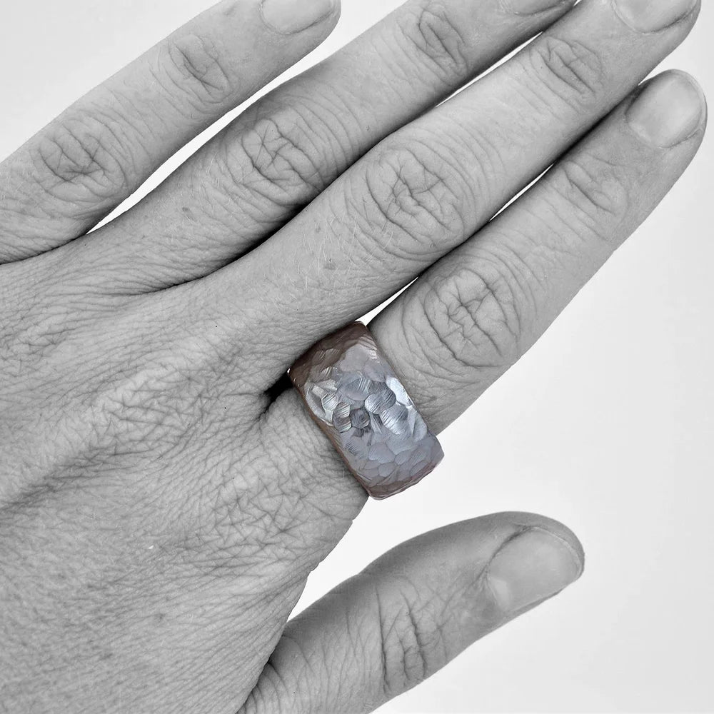 Wide Hammered Band by Shaya Durbin worn on a hand, highlighting the substantial 13mm sterling silver profile and irregular sculptural hammered texture.