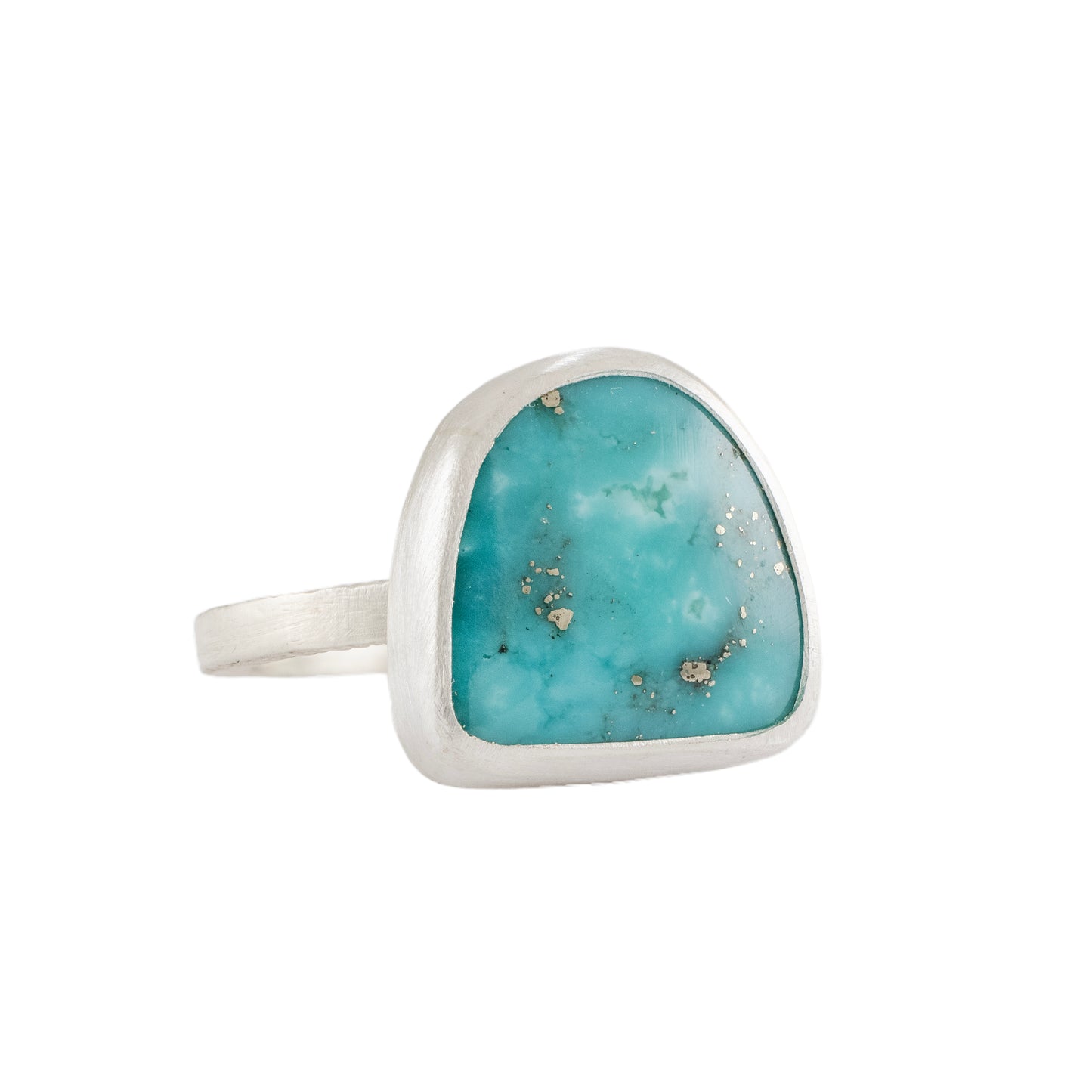 Turquoise ring with silver band on a white background