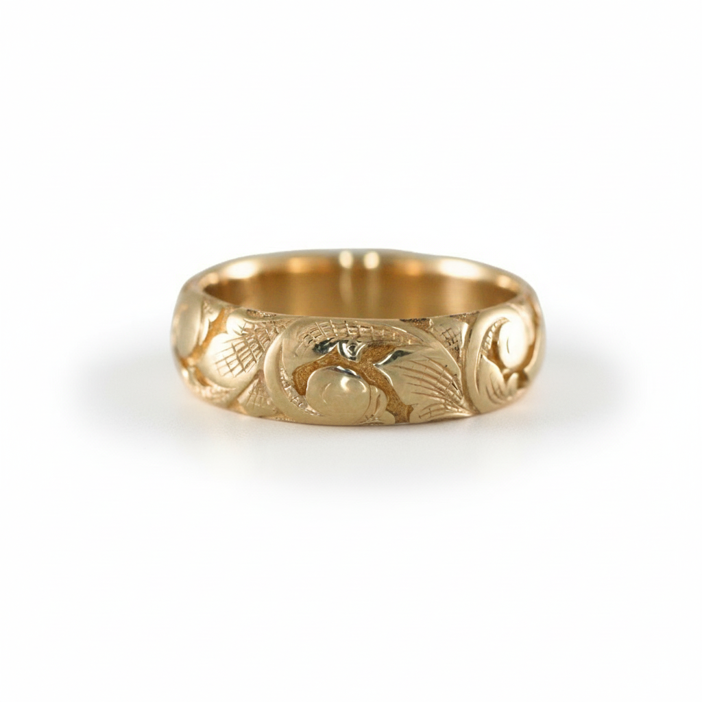 14k gold slim acanthus band on white background – detailed hand-engraved scroll and leaf motifs.