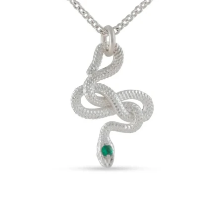 Snake Guardian Necklace by Michaela Farkasovska featuring a sculptural sterling silver serpent pendant with a small green emerald at its tail.