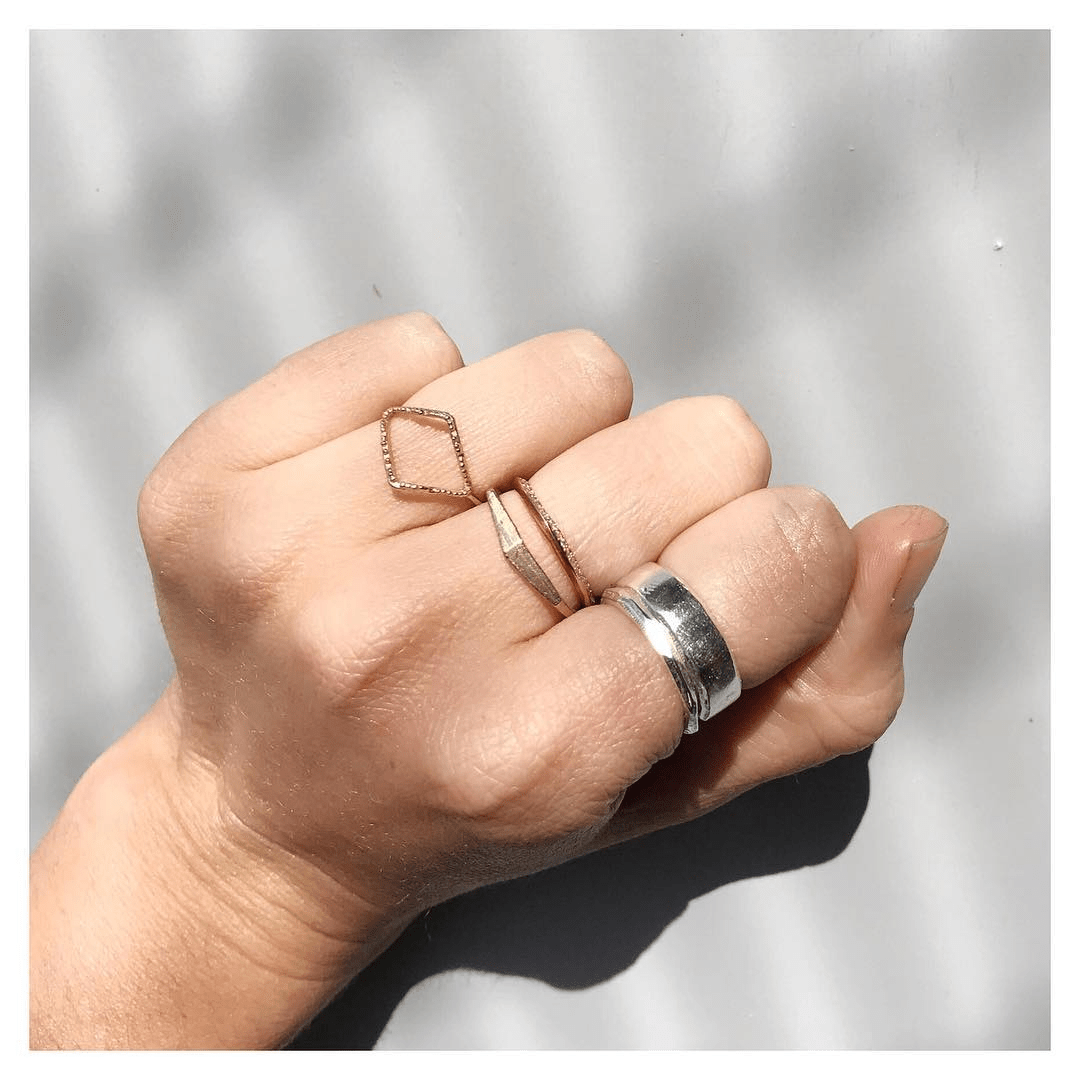 Crag Ring in 14k yellow gold worn on hand, photographed in a natural pose