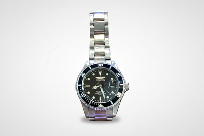 Silver-tone stainless steel wristwatch with a dark round dial and metal link bracelet, displayed against a white background.