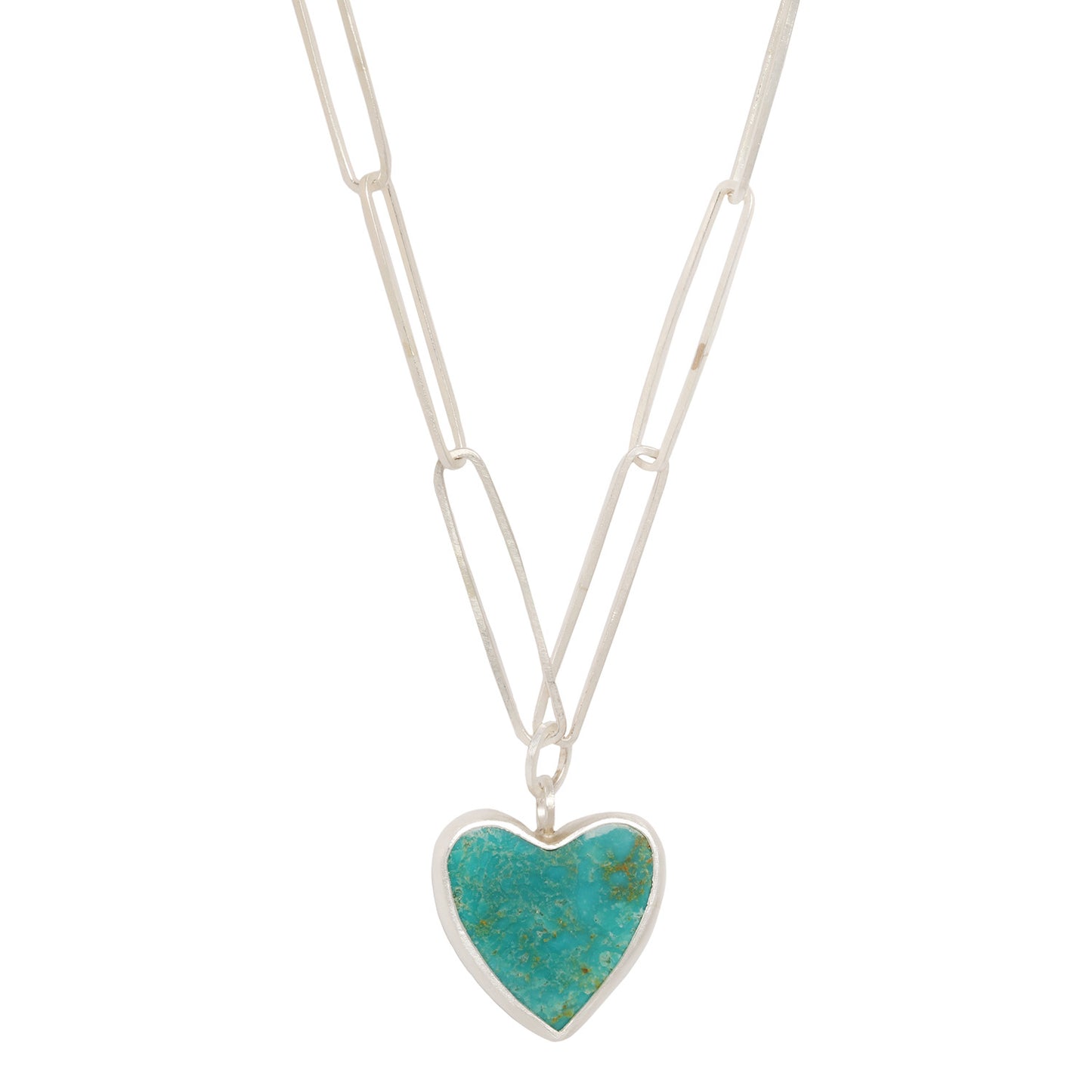 A sterling silver heart-shaped pendant with a turquoise stone, attached to a sterling silver chain.