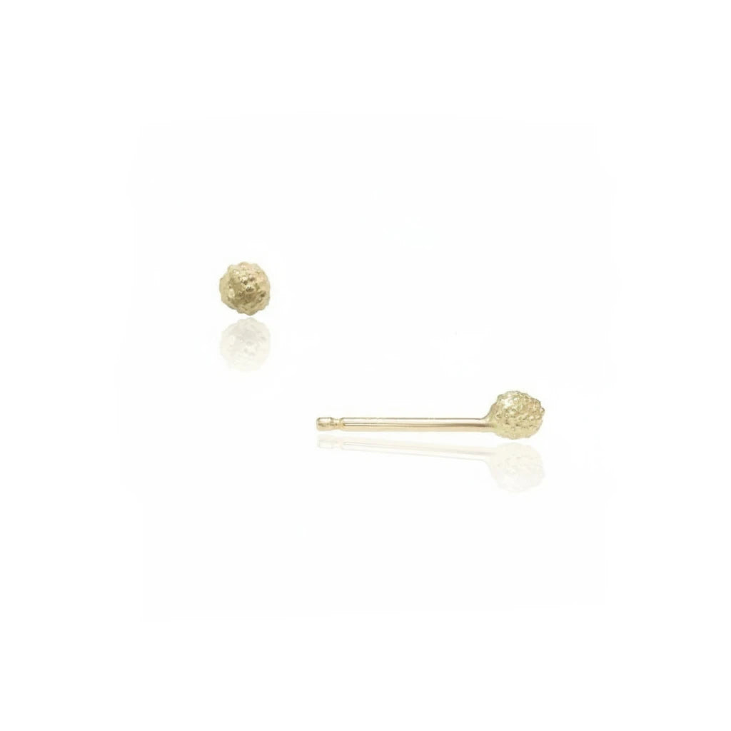 Front and side views of the Stigma Stud Earrings by Alexis Pavlantos in solid 14k yellow gold, featuring a petite 4mm floral center design with organic hand-carved texture.