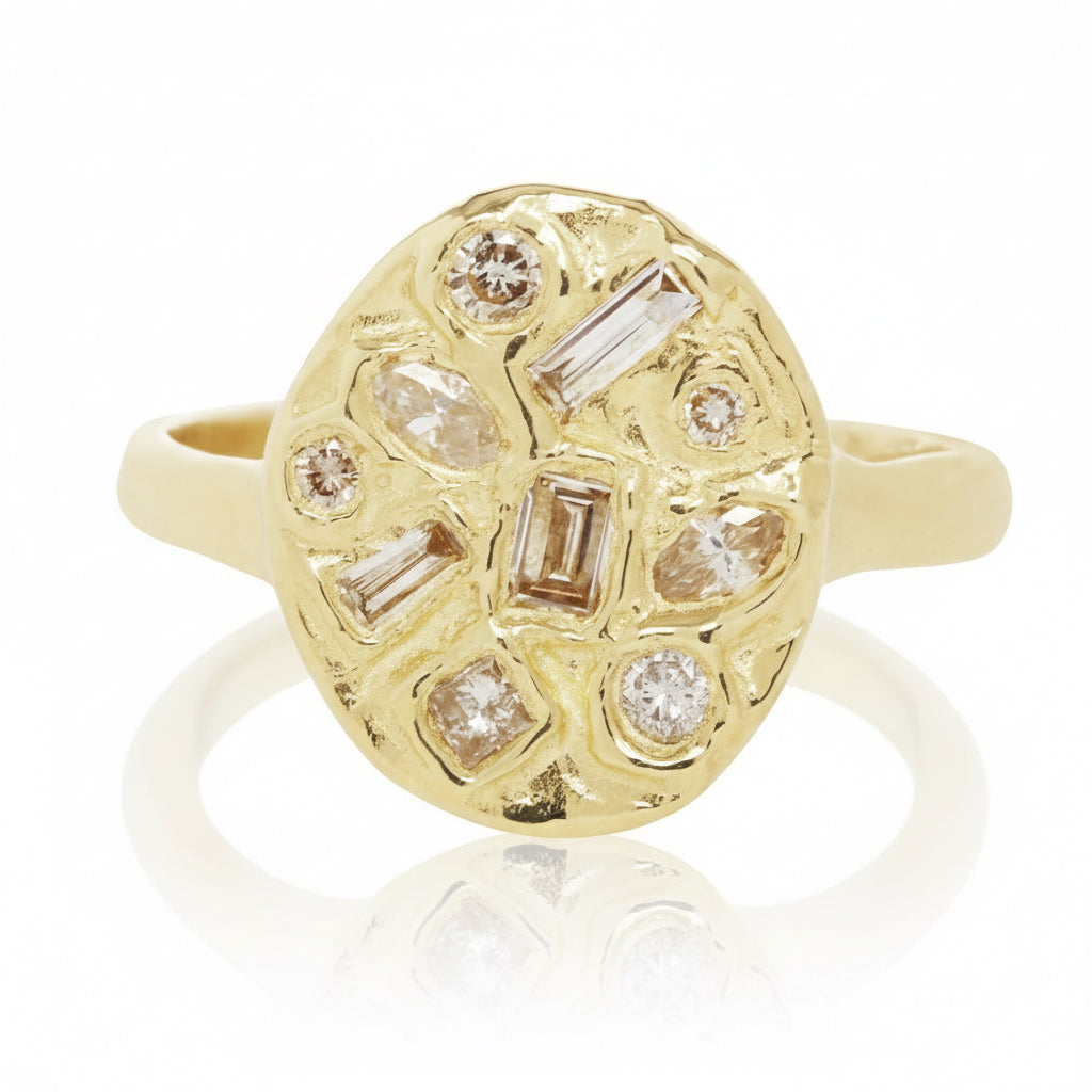 Front view of the Symplegma Diamond Signet Ring by Alexis Pavlantos, featuring a sculptural 18k yellow gold oval signet with assorted rose-cut diamonds totaling 0.70 carats.