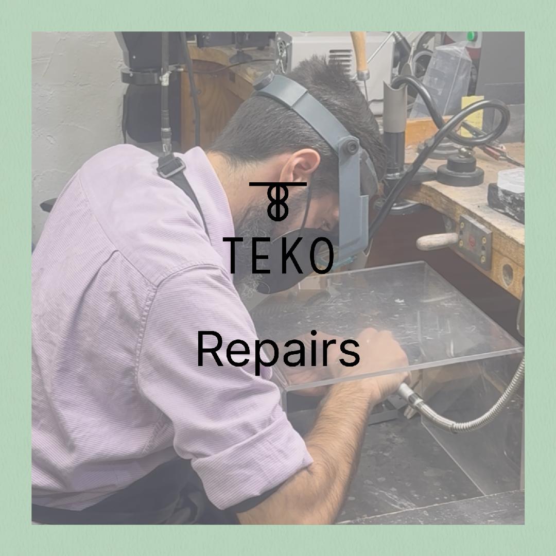 Close-up of jeweler Johnny Renieris working on a ring at his workbench during a jewelry repair at Teko Gallery in Albuquerque, New Mexico.